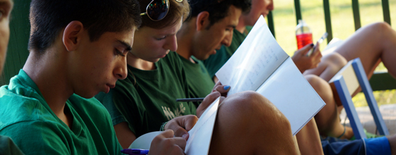 Campers writing in journals