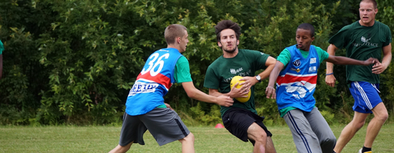 Campers Playing Aussie Rules Football